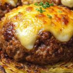 cheesy beef patties on roasted cabbage