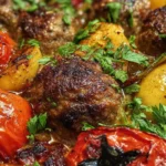 baked meatballs with roasted potatoes and tomatoes